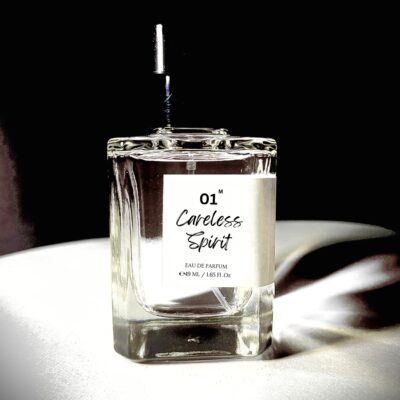 Perfume bottle of Carefree Spirit by Bois et Fleurs Parfums, with vibrant pineapple, lime, cinnamon, tolu balm, nagarmotha, and warm amber woods.