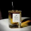 Glass perfume bottle of Bois et Fleurs Parfums featuring notes of pink pepper, lime, lavender, frankincense, vanilla, whipped cream, and dark chocolate.