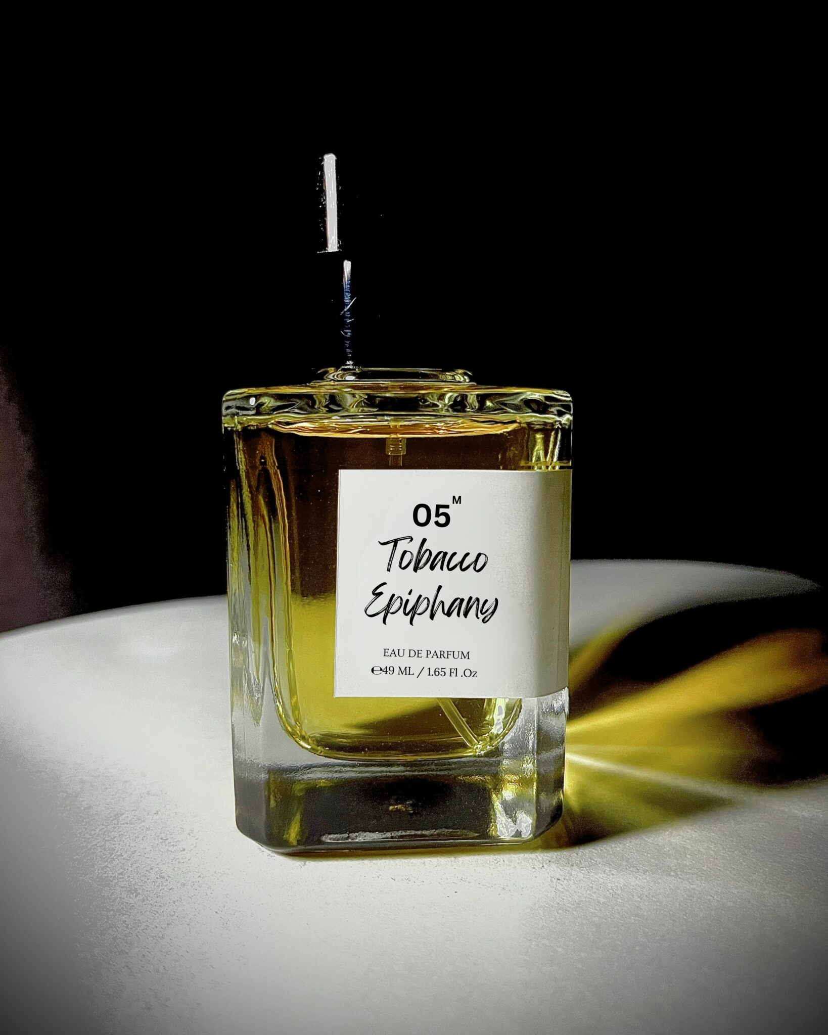 Perfume bottle of Tobacco Epiphany by Bois et Fleurs Parfums, with rich notes of mandarin, plum, honey, dark spices, tobacco, oud, and vanilla.