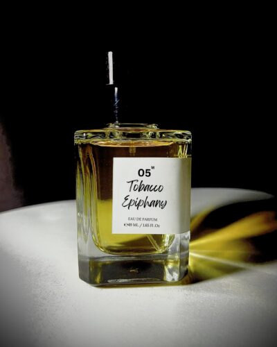 Perfume bottle of Tobacco Epiphany by Bois et Fleurs Parfums, with rich notes of mandarin, plum, honey, dark spices, tobacco, oud, and vanilla.