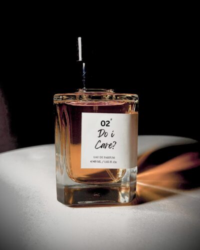 Perfume bottle of Do I Care? by Bois et Fleurs Parfums, featuring bold notes of orange blossom, pink pepper, coffee, jasmine, vanilla, and patchouli.