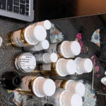 Multiple test vials laid out for the reformulation of a Bois et Fleurs Parfums fragrance — reflecting the brand’s commitment to refinement and responsiveness to customer feedback when the original version didn’t meet expectations.