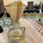 Perfume being filled through a filtration setup to ensure clarity and purity, avoiding any contamination.